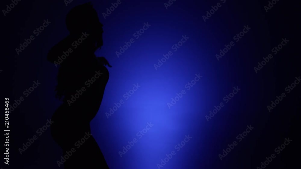 woman dancing silhouette blue background 1.mov woman dancing silhouette blue background 1.mov