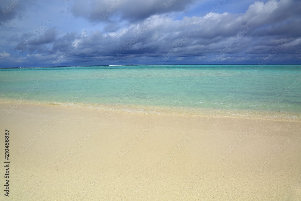 Gorgeous view of Indian Ocean, Maldives. White sand coast line, turquoise ocean water and blue sky with white clouds. Gorgeous nature landscape background. Gorgeous view of Indian Ocean, Maldives. White sand coast line, turquoise ocean water and blue sky with white clouds. Gorgeous nature landscape background.