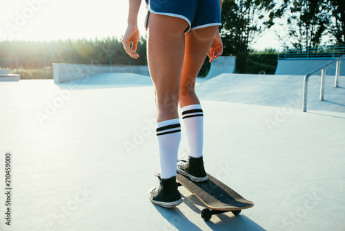 Beautiful skater girl lifestyle moments in a skatepark © oneinchpunch