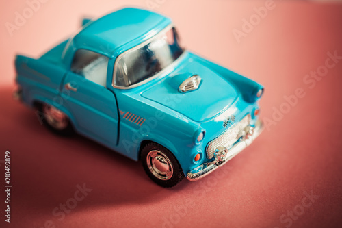 blue toy car on red backgroud