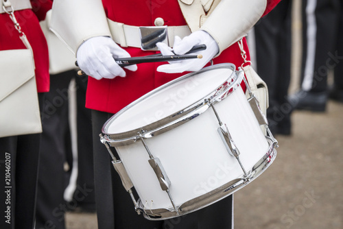 Soldier drummer in red uniform