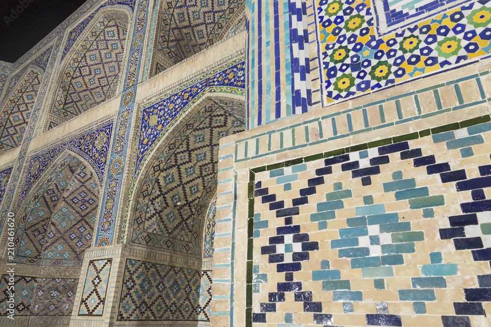 Nadir Divan-Begi Madrasah Mosque wall decoration. Photo shoot from near of the wall. Arabic islamic ceramic decors. Lyabi-hauz. Bukhara, Uzbekistan