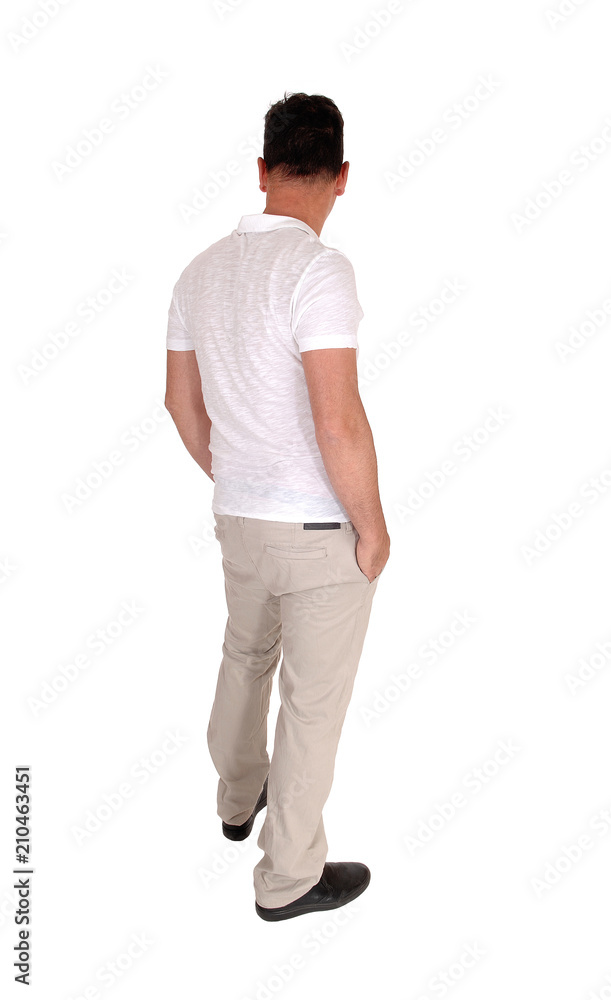Man standing relaxed in casual clothing from the back Man standing relaxed in casual clothing from the back