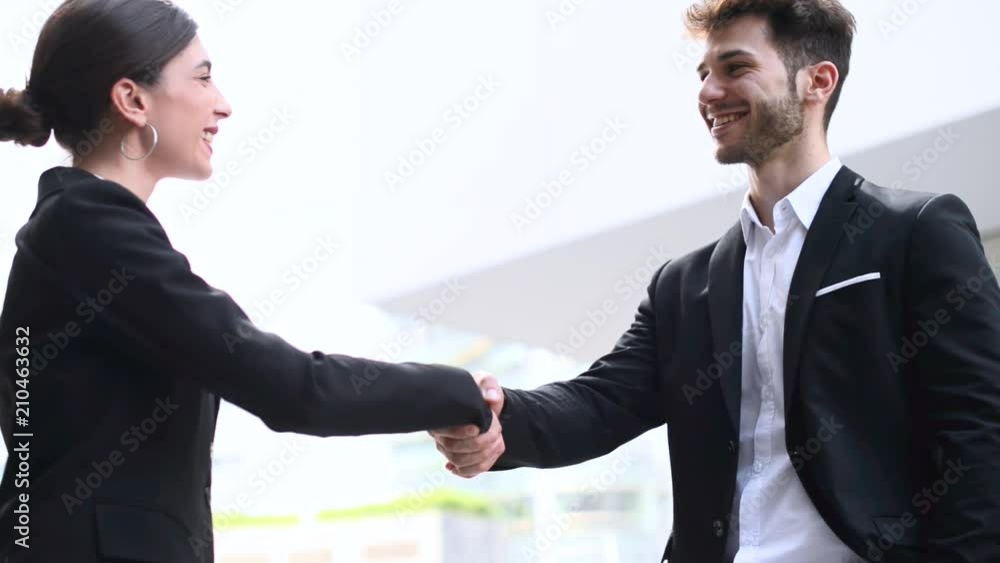 Handshake between business people outdoor Handshake between business people outdoor