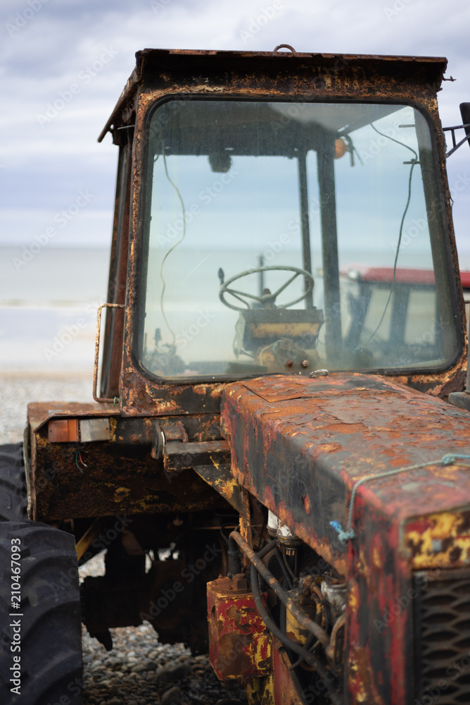 Rusty tractor on the beach