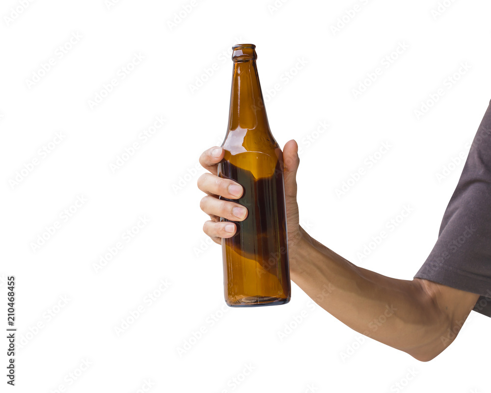 Hand holding beer bottle isolated on white background. Clipping path of transparent brown bottle without label. Hand holding beer bottle isolated on white background. Clipping path of transparent brown bottle without label.