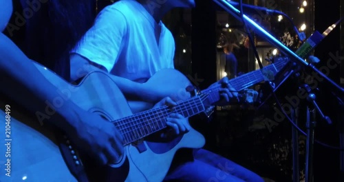 Musician in the restaurant. Bangkok, Thailand. musician play and sing the music for customer to come have dinner in the restaurant at night.