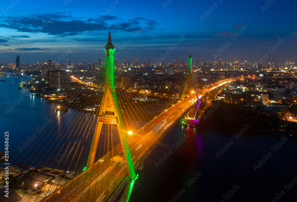 Obraz premium Aerial view ofBangkok Expressway top view, Aerial view of the highway,expressway and motorway at night, Aerial view interchange of a city, Expressway is an important infrastructure in Thailand