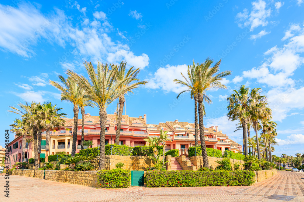 Beautiful colorful houses and palm trees in Sotogrande marina, Andalusia, Spain
