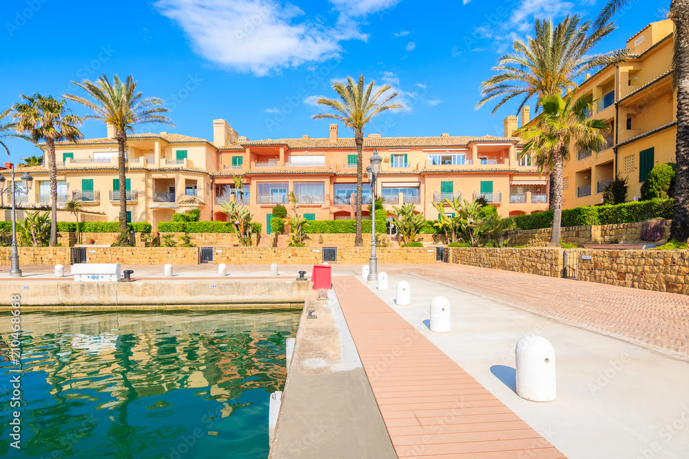 Promenade with beautiful colorful houses in Sotogrande marina, Andalusia, Spain