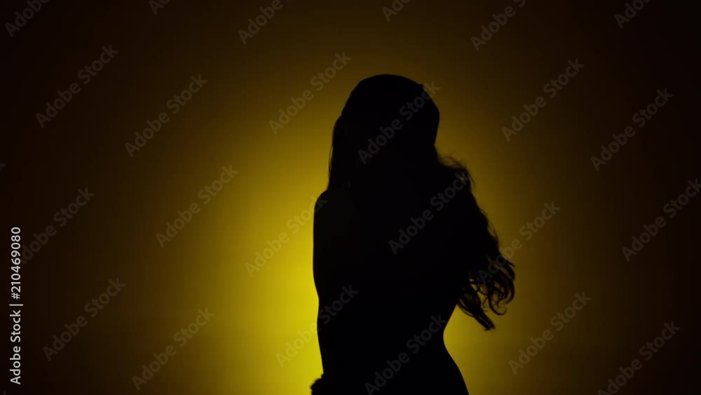 woman dancing silhouette yellow background slomo 2.mov woman dancing silhouette yellow background slomo 2.mov