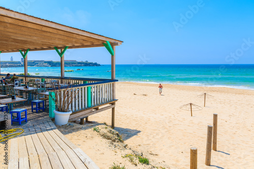 Restaurant terrace on sandy Tarifa beach, Costa de la Luz, Spain