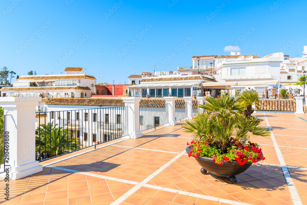 MIJAS TOWN, SPAIN - MAY 9, 2018: Terrace with white houses in picturesque village of Mijas, Andalusia. Spain is second most visited by tourists country in Europe.