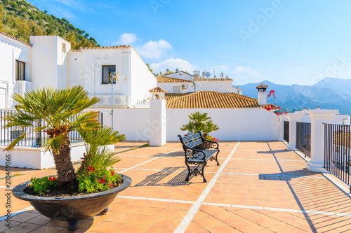 MIJAS TOWN, SPAIN - MAY 9, 2018: Terrace with white houses in picturesque village of Mijas, Andalusia. Spain is second most visited by tourists country in Europe. photo