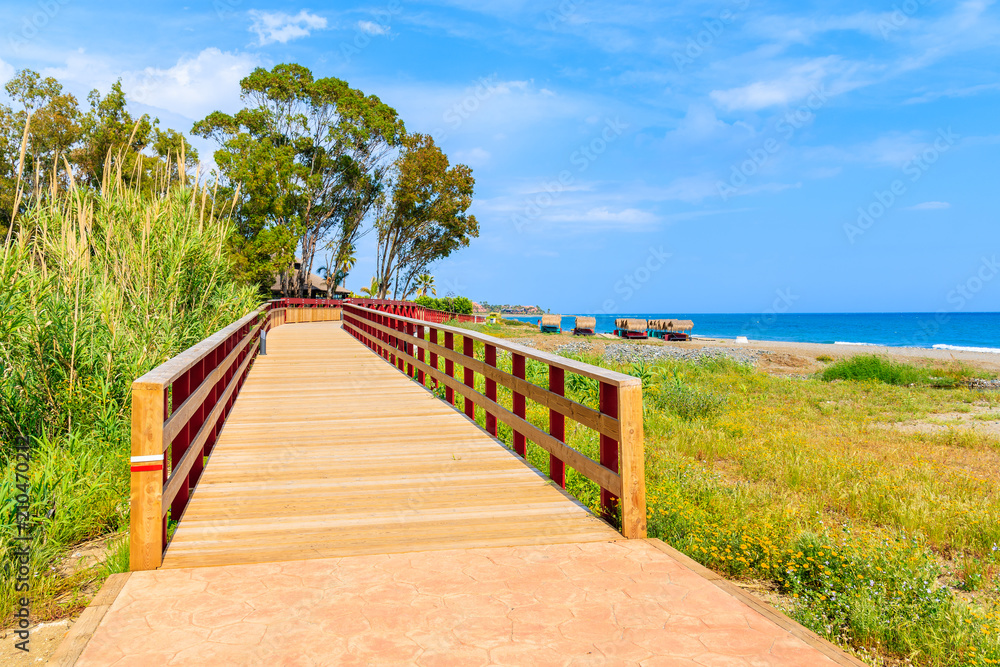 Footbridge and walking path to beach near Estepona town on Costa del Sol, Spain