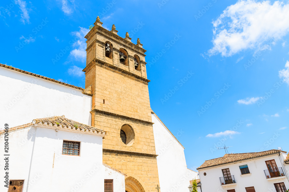 Fototapeta premium White facade and tower of church building in Andalusian village of Ronda, Spain