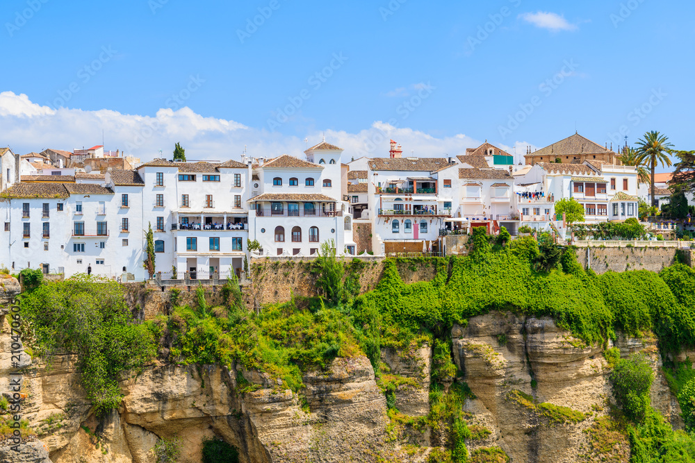 White houses on cliff in Andalusian village of Ronda, Spain White houses on cliff in Andalusian village of Ronda, Spain