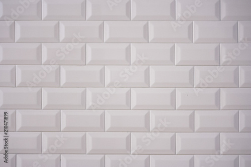 Ceramic rectangular white tile laid horizontally. Glazed white ceramic brick for interior walls