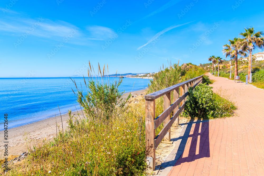 View of beach and coastal path near Estepona town on Costa del Sol, Spain