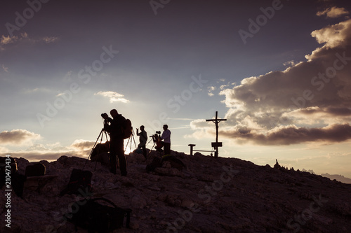 Photographers on the summit of Mount Lagazuoi awaiting the sunset, Dolomites, Italy