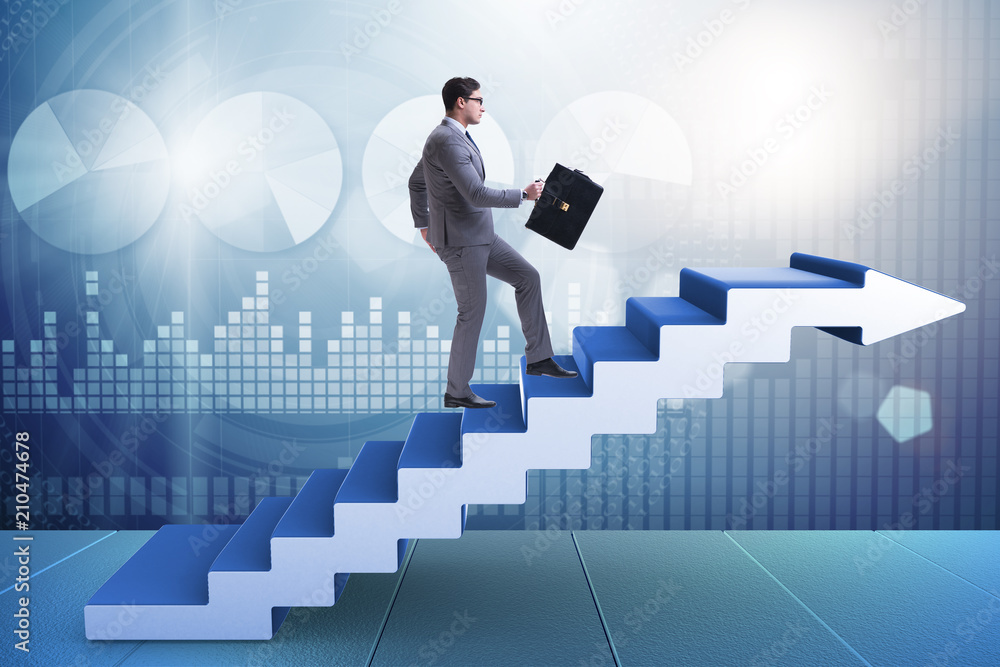 Businessman climbing career ladder in business concept Businessman climbing career ladder in business concept