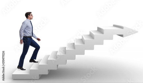 Obraz na plátně Businessman climbing career ladder in business concept