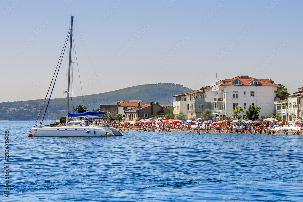 Istanbul, Turkey, 24 July 2011: Kinali Island Beach and Sailboat, Princes Islands district of Istanbul