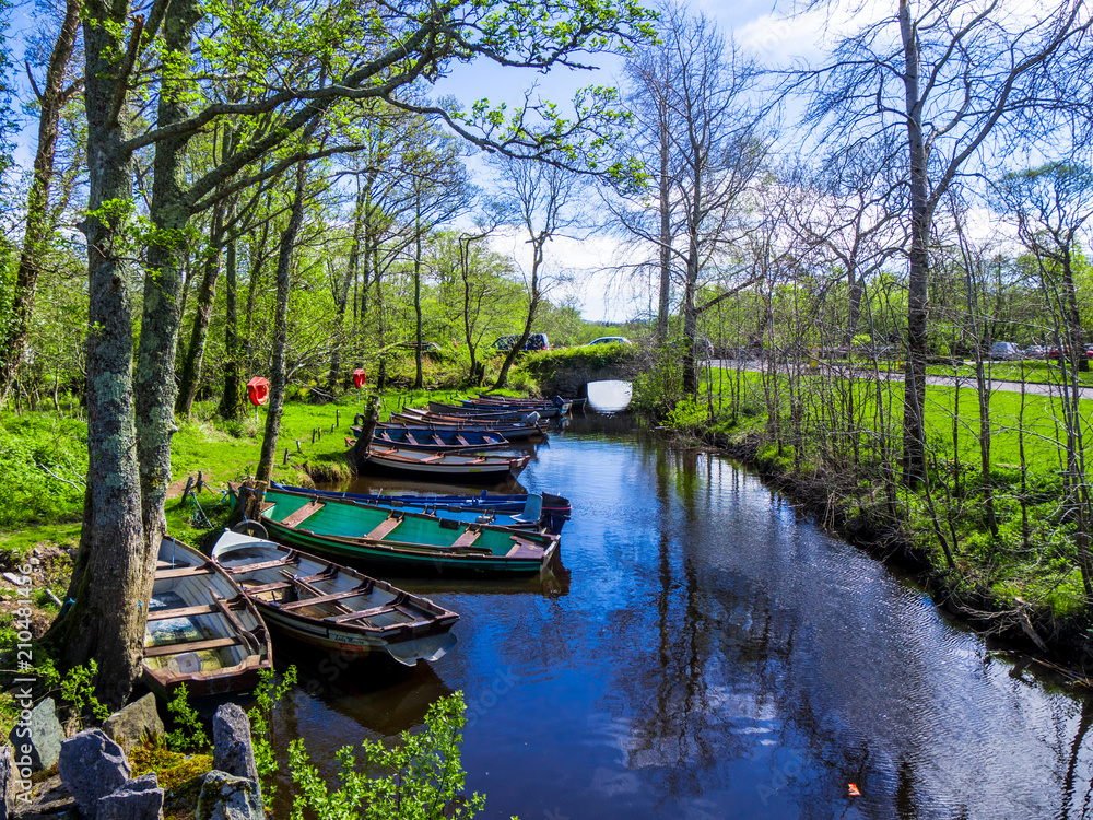 Small boats lying in a creek of Killarney National Park in Ireland Small boats lying in a creek of Killarney National Park in Ireland