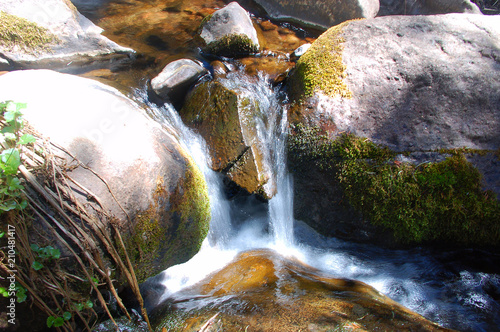 Sunset on a small stream and rocks in the Sangre De Cristo Mnts of Southern Colorado.