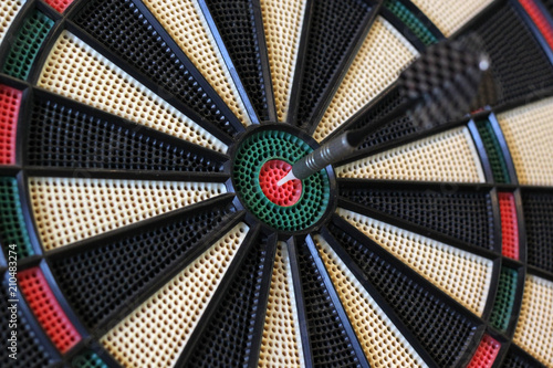 dart hits target in the centre of dartboard