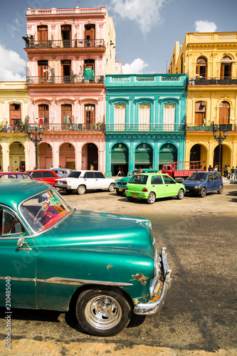 classic car and colored buildings in Havana
