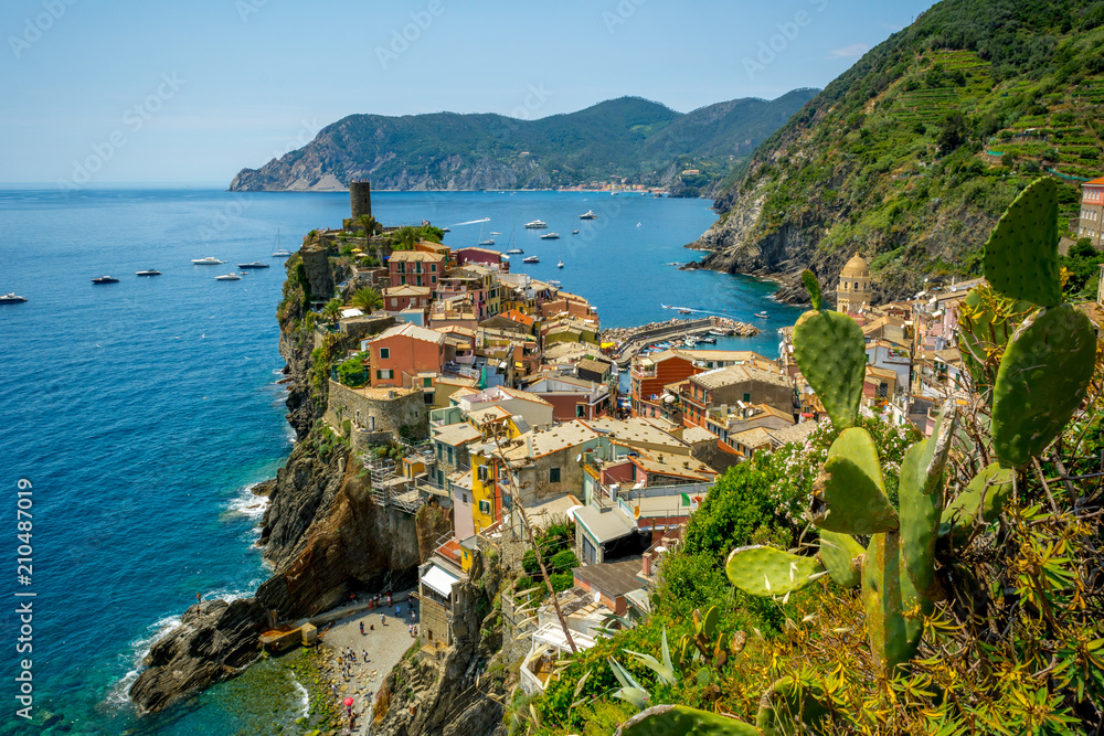 Horizontal View of the Town of Vernazza on blue Sea and the Coastline of the Liguria Background.