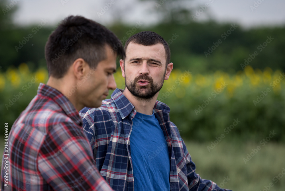 Farmers talking in field Farmers talking in field