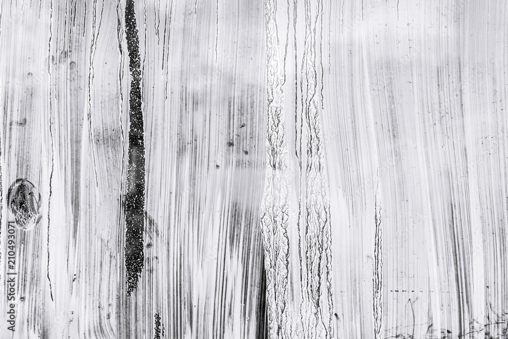 abstract hand painted glass surface background. whitewash paint blots