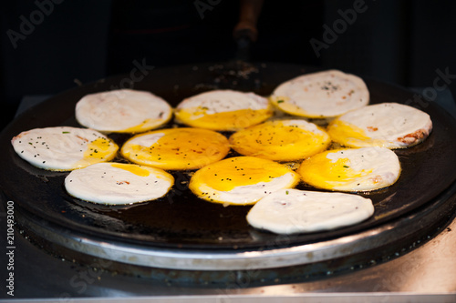 Guoqui chinese pancake cooked with oil in a stove, China photo