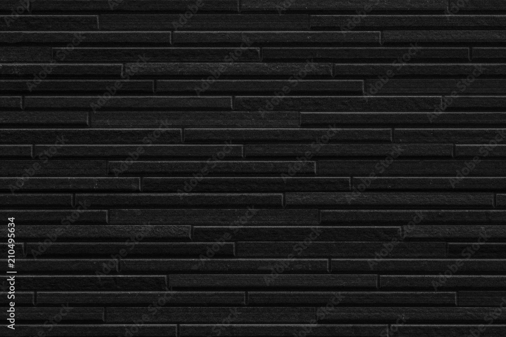 Fototapeta premium Modern black stone tile wall pattern and seamless background