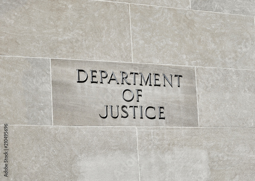 Department of Justice sign on Building Wall photo