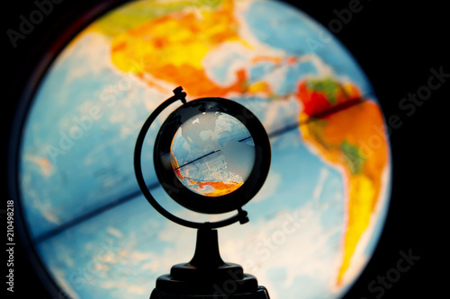 фотографія Luminous desktop globe, view oh North and South Americas through small transpare