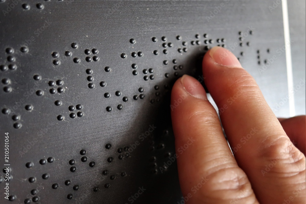 Ταπετσαρία Close up of male hand reading braille text