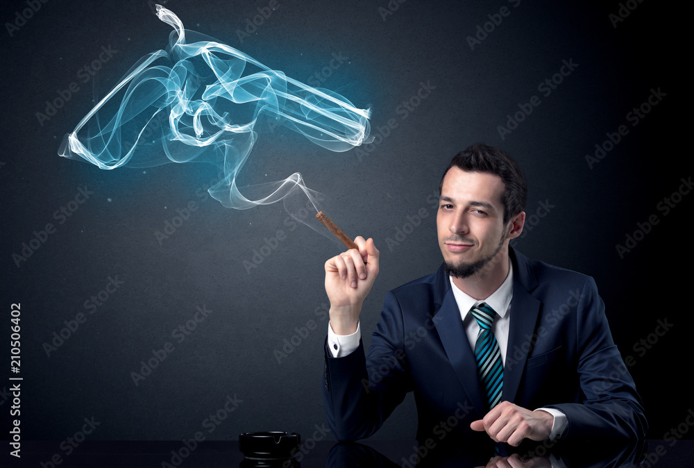 Businessman resting and smoking in a dark room. Businessman resting and smoking in a dark room.