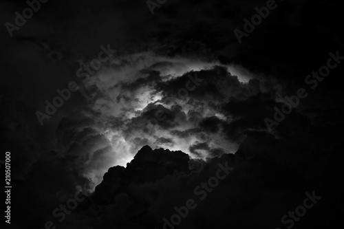 The strongest thunderstorm over the mountains of the Caucasus in the night sky. Flash of lightning above the head in the clouds. Thunderous thunder.