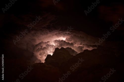 Photography Lightning in the night sky is high in the mountains