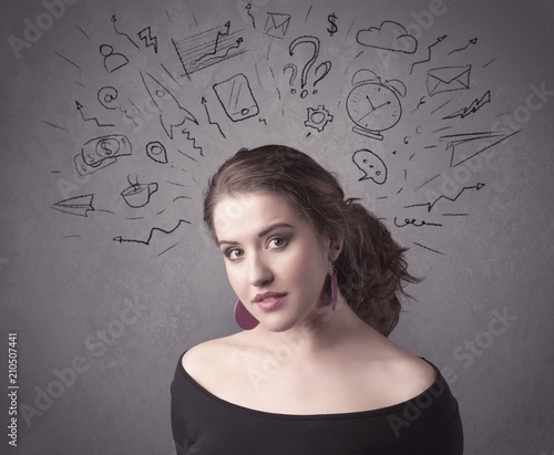 A dark brown haired pretty teenage girl with thoughts in her head illustrated by question mark, rocket, money, coffee, clock, email, social life icons drawn on the background wall concept.