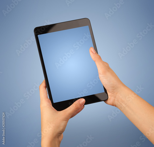 Fototapeta Naklejka Na Ścianę i Meble -  Female fingers touching blank tablet 