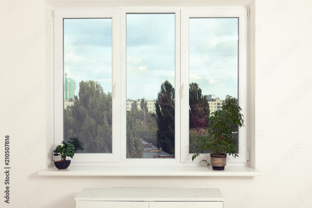 Window in an empty new apartment without curtains Window in an empty new apartment without curtains