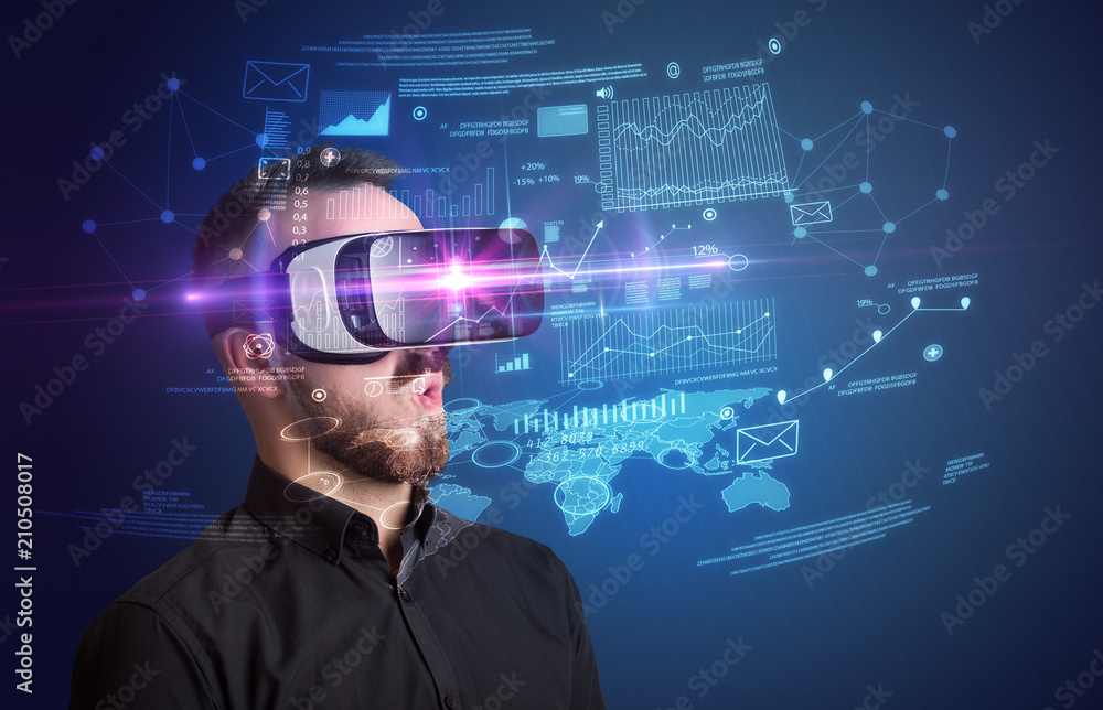 Amazed businessman with virtual reality business plan in front of him Amazed businessman with virtual reality business plan in front of him