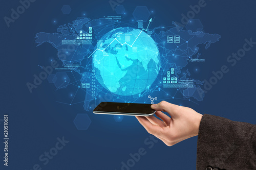 Hand using phone with multinational worldwide estate report concept
