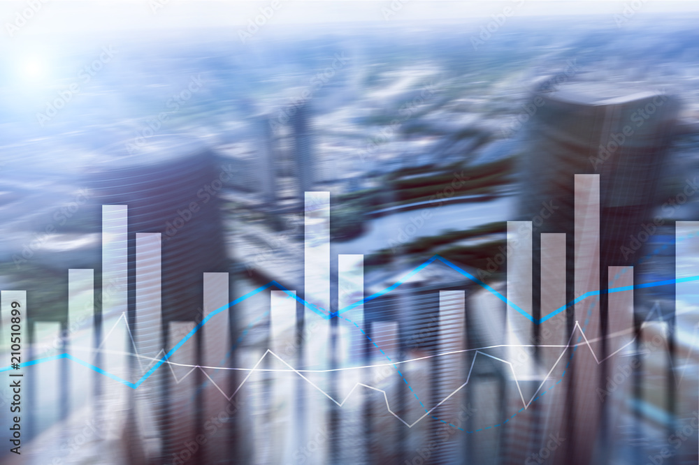 Financial graphs and charts on blurred business center background. Invesment and trading concept. Financial graphs and charts on blurred business center background. Invesment and trading concept.