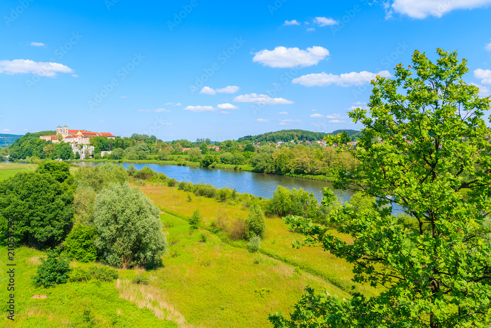 View of Tyniec monastery and green fields along Vistula river on sunny spring day, Cracow city, Poland