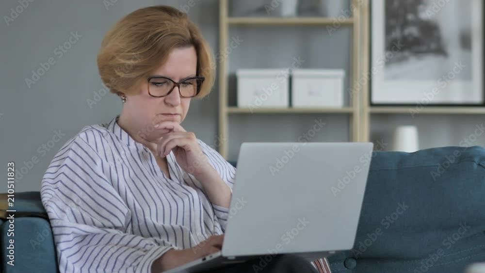 Pensive Old Senior Woman Thinking and Working on Laptop Pensive Old Senior Woman Thinking and Working on Laptop
